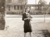 edith-hurff-in-front-yard-with-saunders-house-in-background-img056