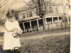 judith-in-front-yard-of-grandparents-with-her-home-in-background-img336