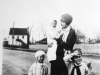 ethel-godwin-holding-daughter-ann-jenny-woodard-and-bernard-godwin-jr-in-front-of-godwin-sawmill-with-gwaltney-store-in-background-circa-1929-img334